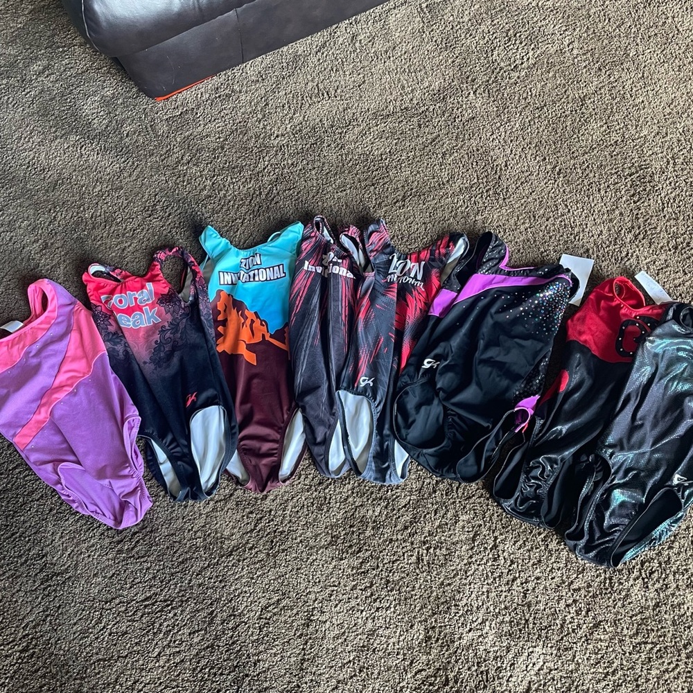 8 good-excellent condition gymnastics leos, tags have been cut out.